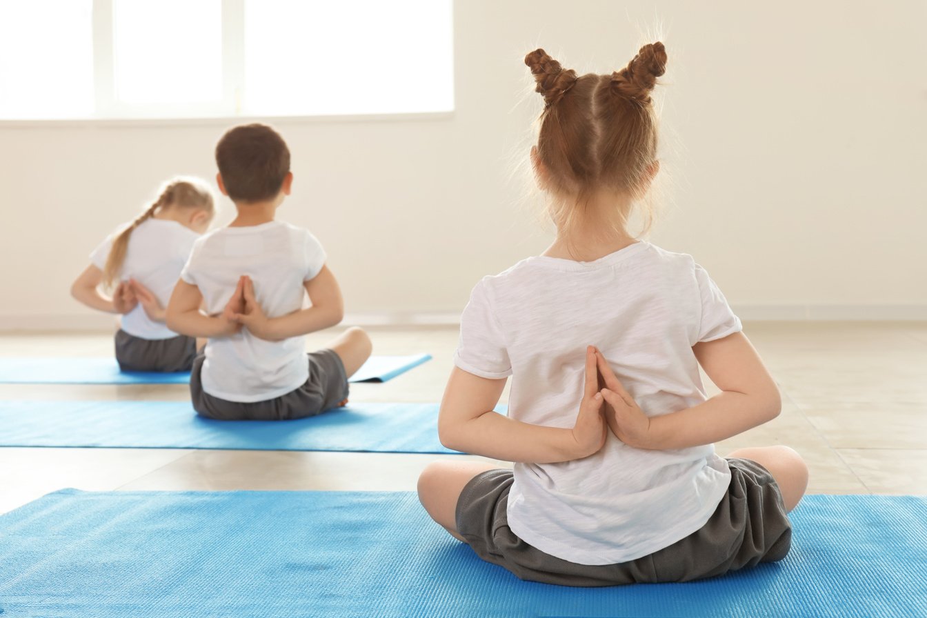 Little Children Practicing Yoga Indoors